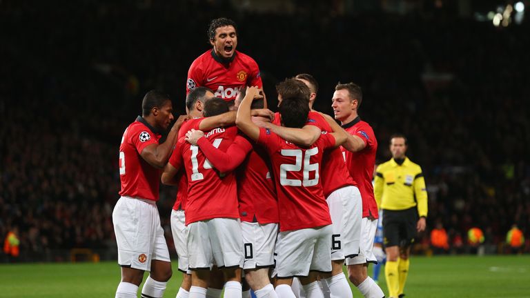 Wayne Rooney of Manchester United celebrates with his team-mates after Inigo Martinez of Real Sociedad scored an own goal to make the score 1-0 during the UEFA Champions League Group A match between Manchester United and Real Sociedad at Old Trafford.