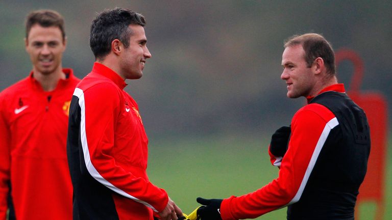 Wayne Rooney (R) and Robin van Persie of Manchester United talk during a training session ahead of their Champions League Group A match against Shakhtar Donetsk at their Carrington Training Complex on October 01, 2013.
