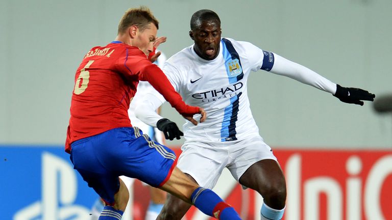 Aleksei Berezutski (L) of PFC CSKA Moscow in action against Yaya Toure of Manchester City FC during the UEFA Champions League Group D match between PFC CSKA Moscow and Manchester City FC at the Arena Khimki Stadium on October 23, 2013 in Khimki, Russia.  