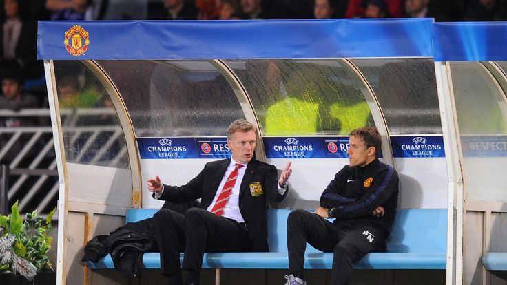 Manchester United manager David Moyes reacts with Phil Neville to the sending off of Marouane Fellaini during the UEFA Champions League Group A match between Real Sociedad and Manchester United 