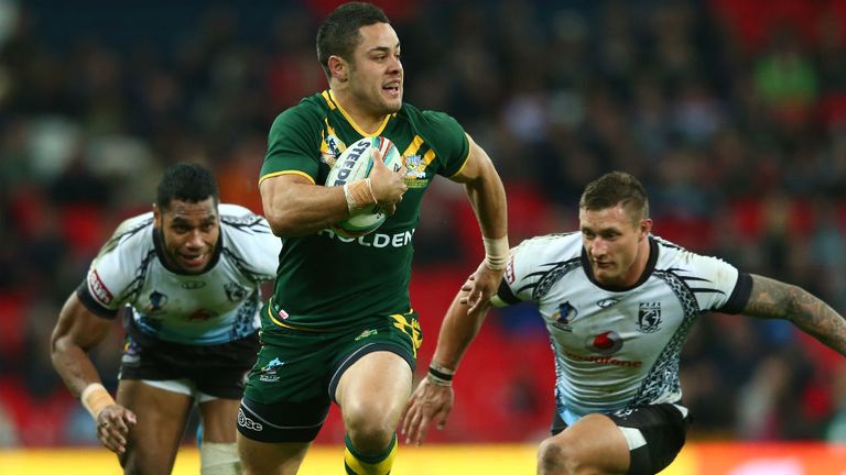 - Jarryd Hayne C of Australia bursts past Sisa Ledua Waqa L and Tariq Sims R of Fiji on his way to scoring a try during the Rugby League World Cup Semi Final