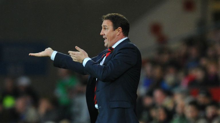 Cardiff boss Malky Mackay urges his players on against derby rivals Swansea
