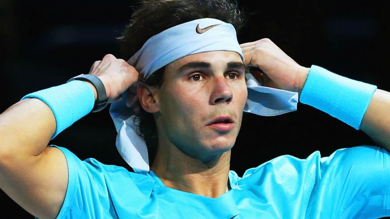 - Nadal of Spain puts on his headband during his mens singles semi-final match against Roger Federer of Switzerland