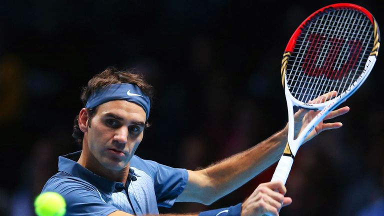 - Federer of Switzerland plays a backhand during his mens singles semi-final match against Rafael Nadal of Spain
