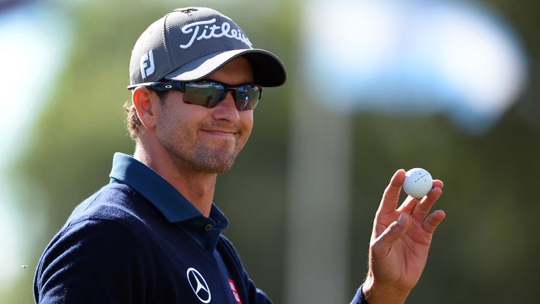 Adam Scott of Australia acknowledges applause as he finishes on top of the leaderboard after the second round of the the Australian Masters golf tournament played at the Royal Melbourne course in Melbourne, on November 15, 2013