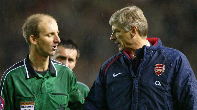 Arsenal manager Arsene Wenger (right) has a word with match referee Mike Riley after his team's defeat against Manchester United in the Barclays Premiership match at Old Trafford, Manchester.   THIS PICTURE CAN ONLY BE USED WITHIN THE CONTEXT OF AN EDITORIAL FEATURE. NO WEBSITE/INTERNET USE UNLESS SITE IS REGISTERED WITH FOOTBALL ASSOCIATION PREMIER LEAGUE. 