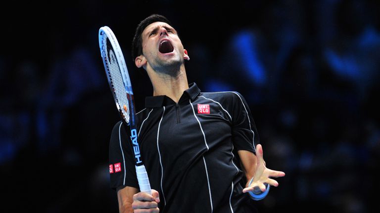 Serbia's Novak Djokovic reacts after a point against Spain's Rafael Nadal during the singles final on the eighth day of the ATP World Tour Finals tennis tournament in London on November 11, 2013