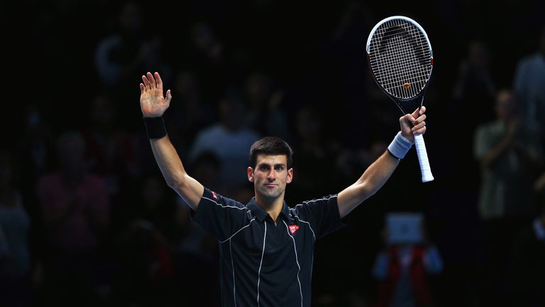 Novak Djokovic of Serbia celebrates victory in his men's singles match against Roger Federer of Switzerland during day two of the Barclays ATP World Tour Finals at O2 Arena on November 5, 2013 in London, England.