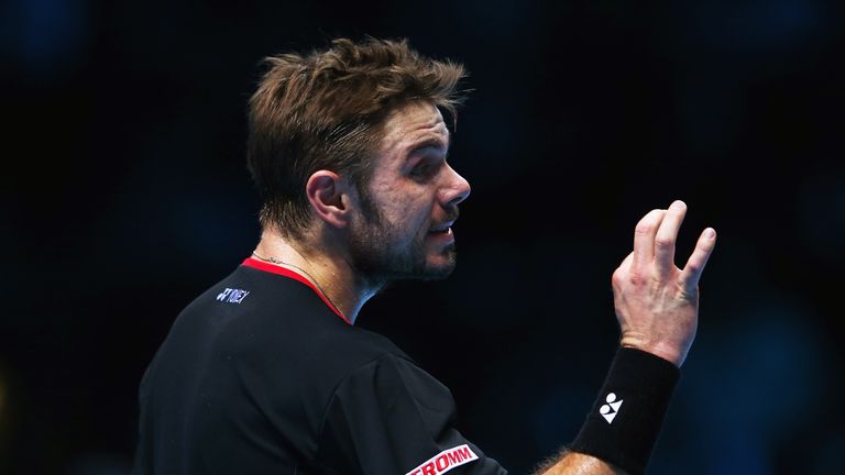 Stanislas Wawrinka gestures in his men's singles semi-final match against Novak Djokovic of Serbia during day seven of the Barclays ATP World Tour Finals at O2 Arena