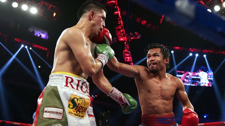 Manny Pacquiao (R) of the Philippines punches Brandon Rios of the U.S. during their 'Clash in Cotai' WBO International Welterweight title fight on November 24, 2013 in Macau