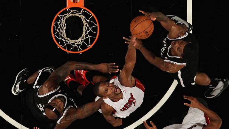 Chris Bosh goes for a block in Miami&#39;s narrow defeat by Brooklyn