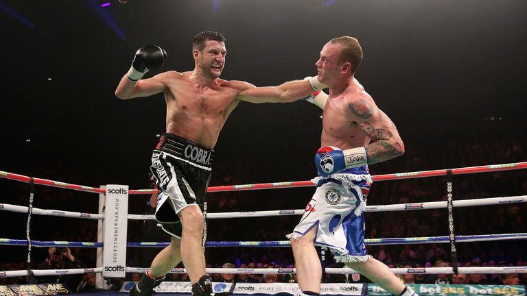 Carl Froch connects with George Groves during their IBF and WBA World super-middleweight bout