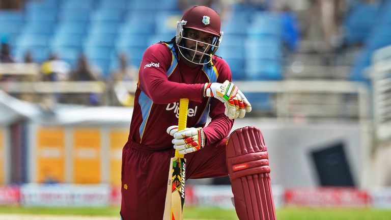 West Indies batsman Chris Gayle waits after his teammate Johnson Charles got catch out during the first match of the Tri-Nation series at the Sabina Park stadium in Kingston on June 28, 2013