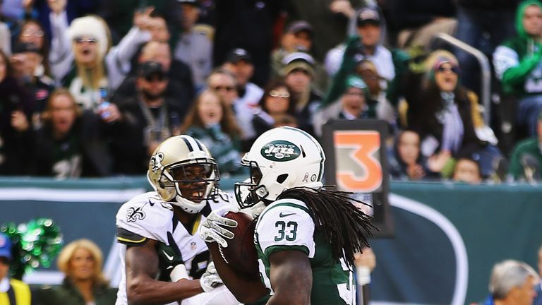 Chris Ivory of the New York Jets scores a touchdown against the New Orleans Saints