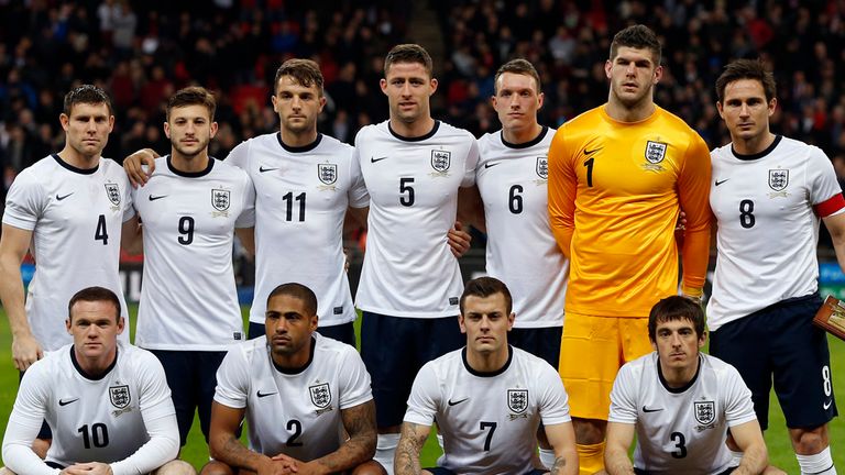 The England starting XI, (top row from L) James Milner, Adam Lallana, Jay Rodriguez, Gary Cahill, Phil Jones, Fraser Forster, Frank Lampard, (bottom row from L) Wayne Rooney, Glen Johnson, Jack Wilshere and Leighton Baines line up for the team photograph before kick off of the international friendly football match between England and Chile at Wembley in north London on November 15, 2013. AFP PHOTO / ADRIAN DENNIS  --  NOT FOR MARKETING OR ADVERTISING USE / RESTRICTED TO EDITORIAL USE        (Photo credit should read ADRIAN DENNIS/AFP/Getty Images)