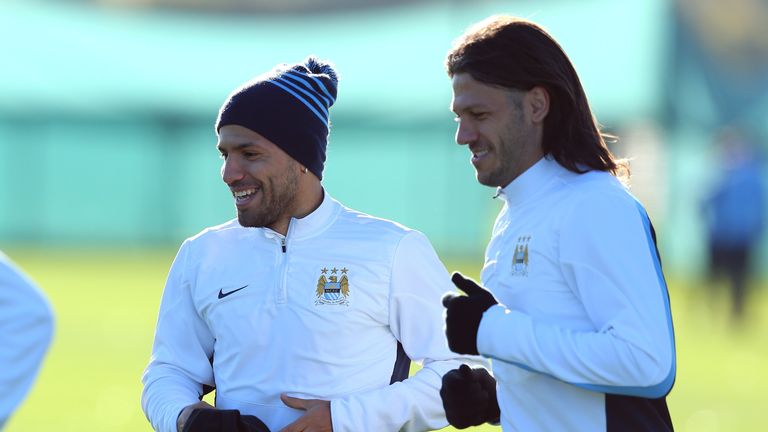 MANCHESTER, ENGLAND - NOVEMBER 04:  Sergio Aguero and Martin Demichelis of Manchester City warm up during a training session at Carrington Training Ground on November 4, 2013 in Manchester, England.  (Photo by Alex Livesey/Getty Images)