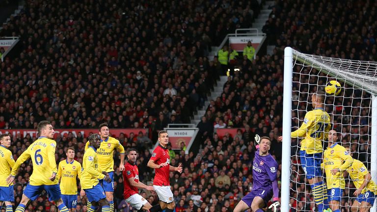 Manchester United's Robin van Persie (centre left) scores their first goal of the game with a header