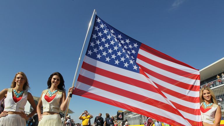 Grid girls with an American flag
