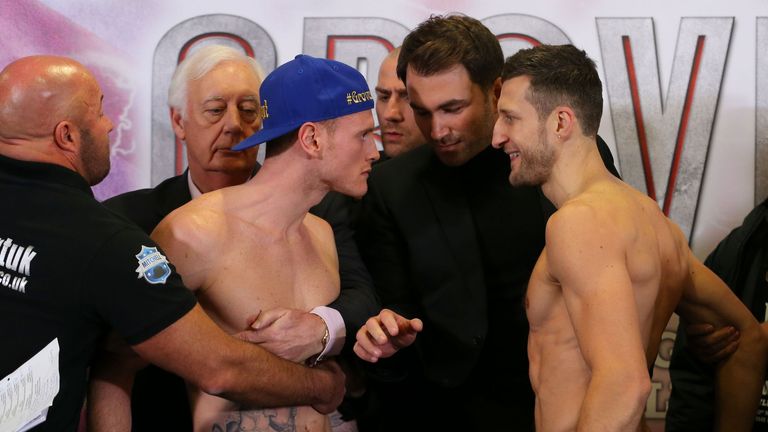 Promoter Eddie Hearn steps in to separate George Groves (left) and Carl Froch at the weigh in at Manchester Central, Manchester.