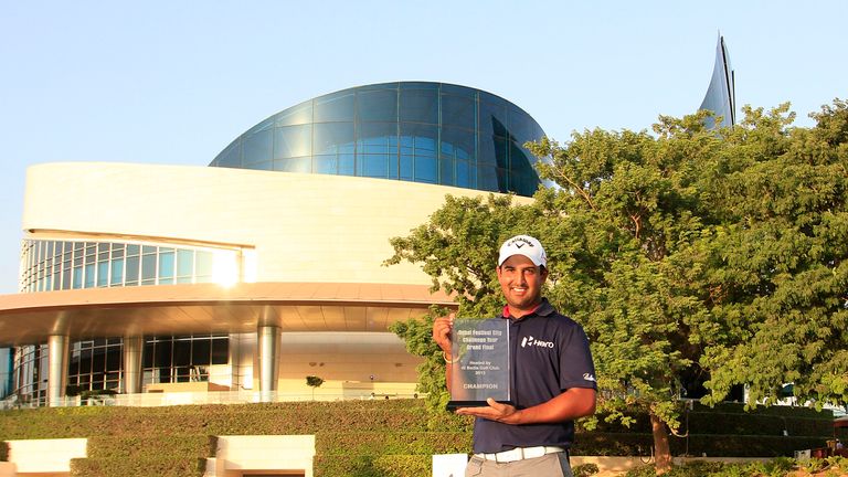 Shiv Kapur of India poses with the trophy after the final round of the Dubai Festival City Challenge Tour Grand Final