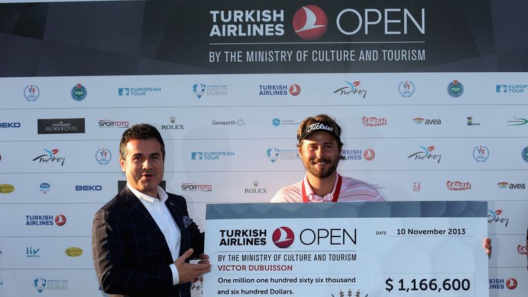 Victor Dubuisson of France is awarded his cheque by Suat Kilic, Turkish Minister for Youth & Sport