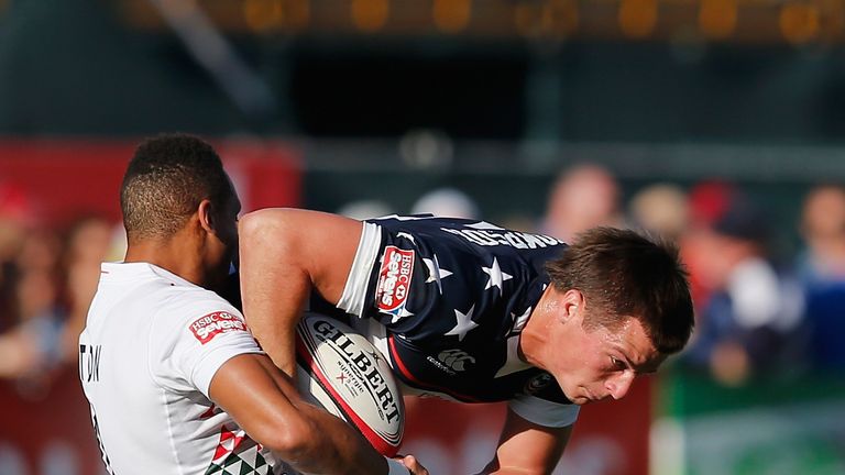 DUBAI, UNITED ARAB EMIRATES - NOVEMBER 29:  Brett Thompson of United States in tackled by Dan Norton of England during the Dubai Sevens match between England  and United States, as part of the second round of the HSBC Sevens World Series at  The Sevens stadium on November 29, 2013 in Dubai, United Arab Emirates.  (Photo by Francois Nel/Getty Images)