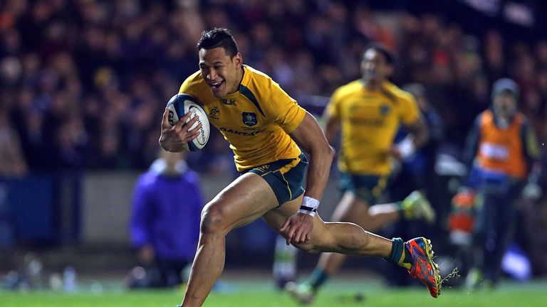 Australia's Israel Folau runs through to score a try during a Test against Scotland