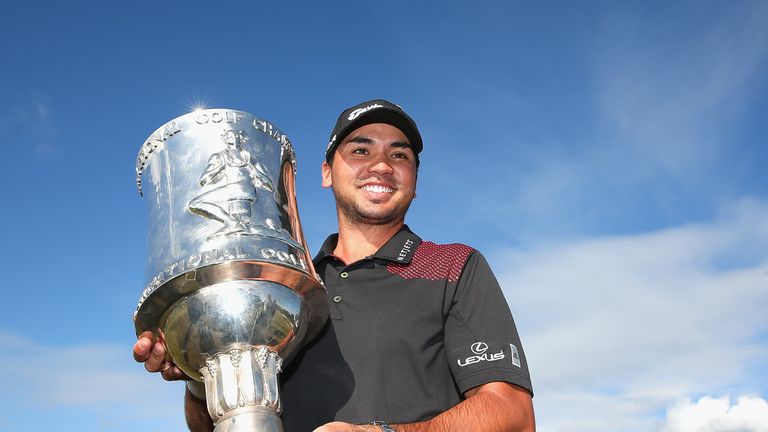 Jason Day of Australia poses with the trophy after winning the tournament  during day four of the World Cup of Golf at Royal Melbourne Golf Course on November 24, 2013 in Melbourne, Australia