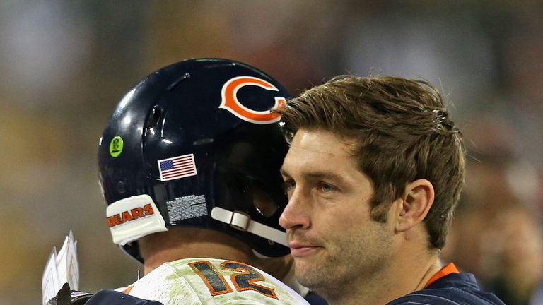 An injured Jay Cutler hugs fellow quarterback Josh McCown of the Chicago Bears after a win at Green Bay Packers