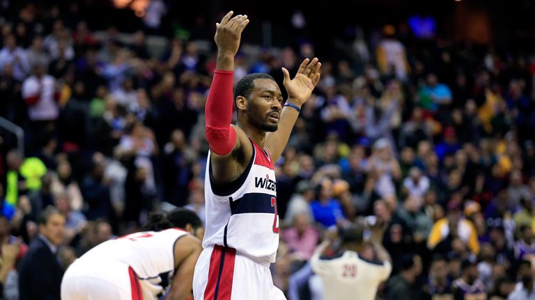 John Wall #2 of the Washington Wizards celebrates during the closing seconds of their 116-111 win over the Los Angeles Lakers at Verizon Center on November 26, 2013 in Washington, DC. 