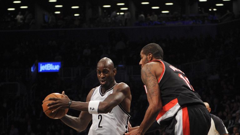 Kevin Garnett #2 of the Brooklyn Nets drives against LaMarcus Aldridge #12 of the Portland Trail Blazers