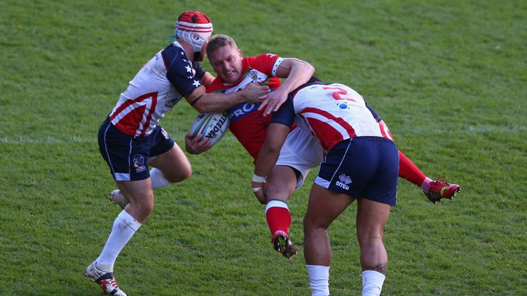 Christiaan Roets is upended by Craig Priestly (L) and Bureta Faraimo (R)
