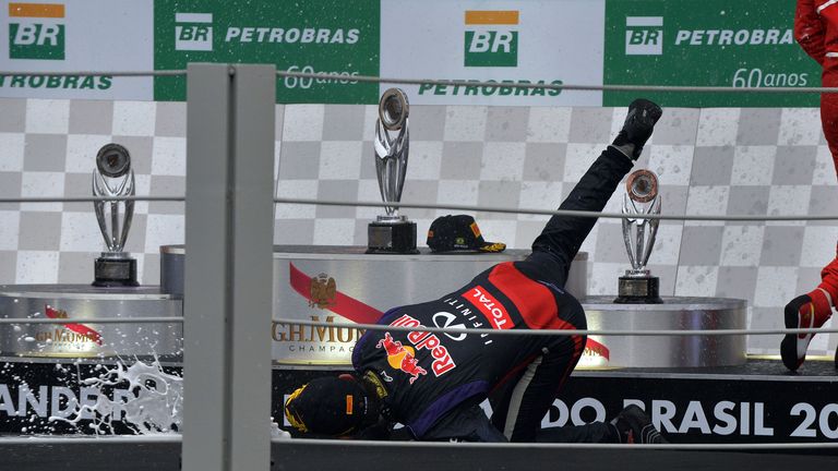 Mark Webber falls over on the podium