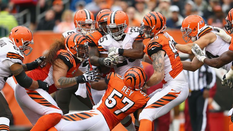 Chris Ogbonnaya of the Cleveland Browns is tackled by the Cincinnati Bengals during the NFL game at Paul Brown Stadium on November 17