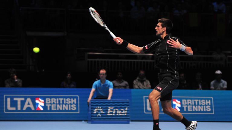 Serbia's Novak Djokovic returns against Spain's Rafael Nadal during the singles final on the eighth day of the ATP World Tour Finals tennis tournament in London on November 11, 2013