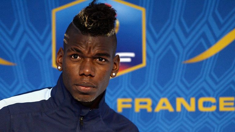 France's national football team midfielder Paul Pogba arrives for a press conference in Clairefontaine-en-Yvelines, outside Paris, on November 11, 2013, ahead of a two-legged World Cup 2014 qualifying play-off matches against Ukraine. AFP PHOTO / FRANCK FIFE        (Photo credit should read FRANCK FIFE/AFP/Getty Images)