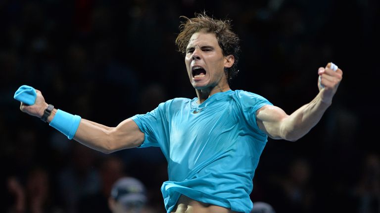Spain's Rafael Nadal leaps in the air as he celebrates beating Switzerland's Stanislas Wawrinka during their group A singles match in the round robin stage on the third day of the ATP World Tour Finals tennis tournament in London on November 6, 2013. Nadal won 7-6, 7-6