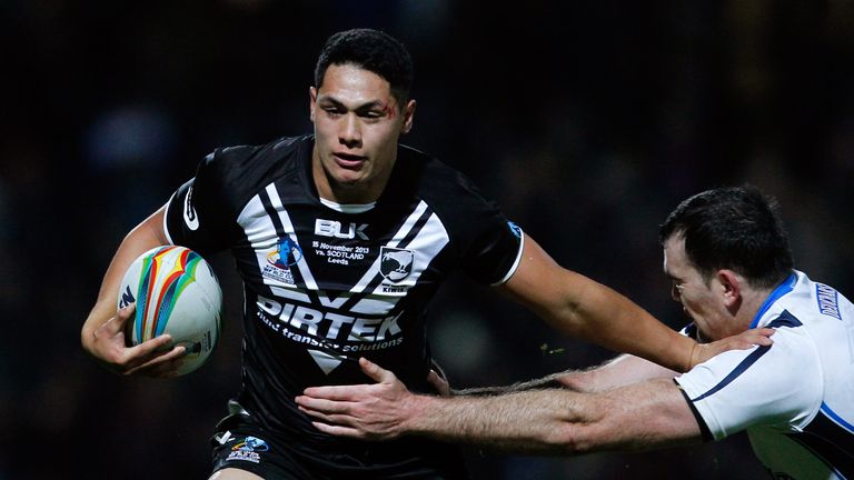Roger Tuivasa-Sheck of New Zealand (L) in action with Kane Linnett of Scotland during the Rugby League World Cup Quarter Final match between New Zealand and Scotland at Headingley Stadium