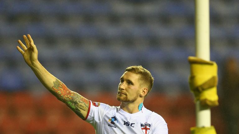 Sam Tomkins of England acknowledges the home support during a lap of honour after the Rugby League World Cup Quarter Final match between England and France at the DW Stadium