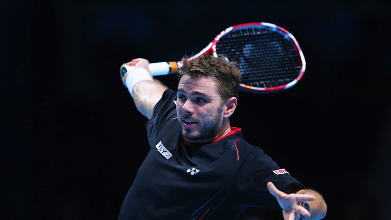 Stanislas Wawrinka plays a backhand in his men's singles match against Tomas Berdych at the Barclays ATP World Tour Finals