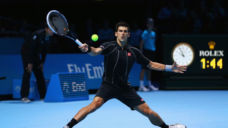 Novak Djokovic of Serbia hits a forehand in his men's singles match against Roger Federer of Switzerland during day two of the Barclays ATP World Tour Finals at O2 Arena on November 5, 2013 in London, England