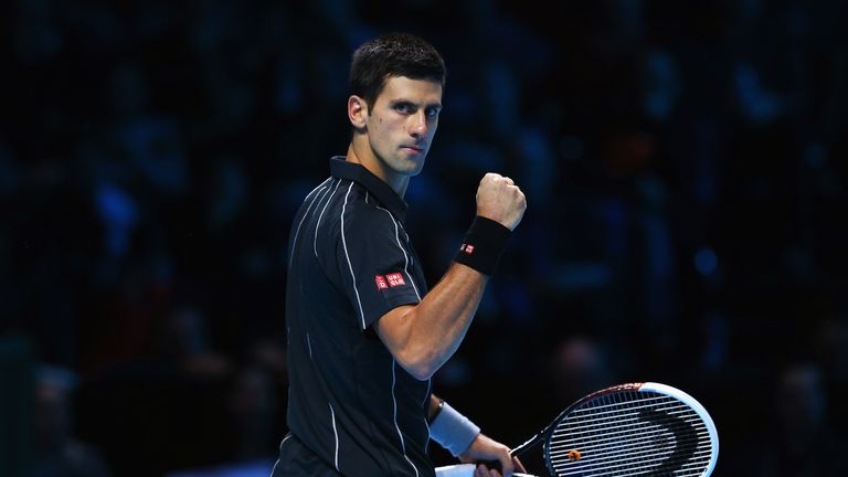 Novak Djokovic of Serbia celebrates winning the first set in his men's singles match against Roger Federer of Switzerland during day two of the Barclays ATP World Tour Finals at O2 Arena on November 5, 2013 in London, England