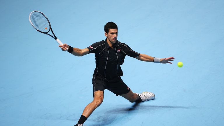 Novak Djokovic of Serbia hits a forehand in his men's singles final match against Rafael Nadal of Spain during day eight of the Barclays ATP World Tour Finals at O2 Arena on November 11, 2013 in London, England