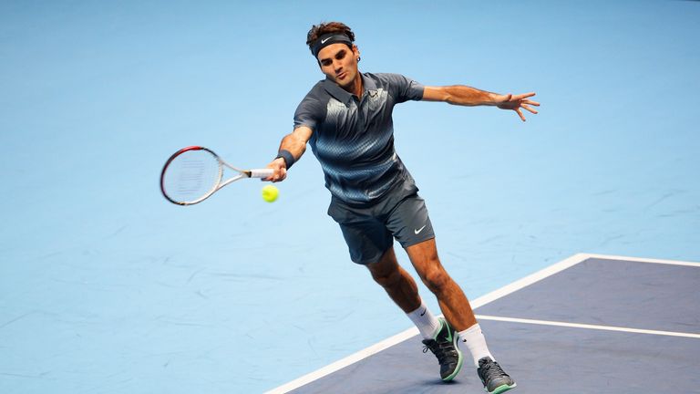 Roger Federer of Switzerland hits a forehand in his men's singles match against Novak Djokovic of Serbia during day two of the Barclays ATP World Tour Finals at O2 Arena on November 5, 2013 in London, England
