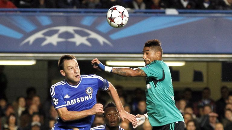 Chelsea's English defender John Terry (L) jumps for the ball with FC Schalke's midfielder Kevin-Prince Boateng (R) during the UEFA Champions League group E football match between Chelsea and FC Schalke at Stamford Bridge in London on November 6, 2013.  AFP PHOTO / IAN KINGTON        (Photo credit should read IAN KINGTON/AFP/Getty Images)