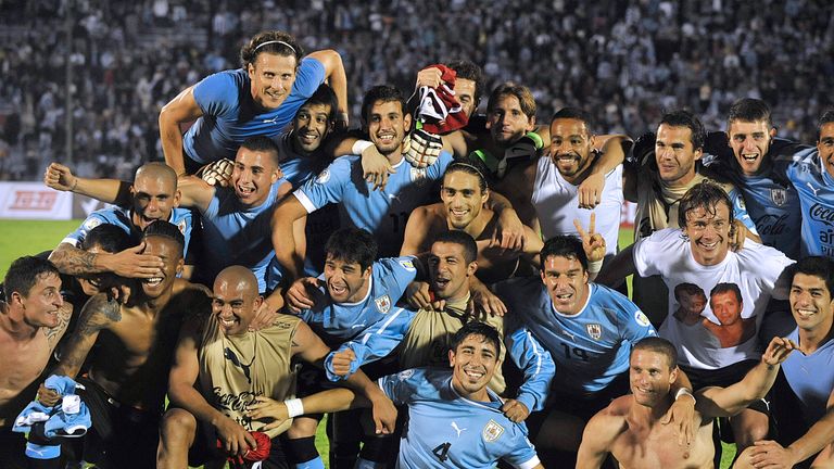 Uruguayan players celebrate after the end of the FIFA World Cup intercontinental play-offs 2nd Leg match against Jordan at the Estadio Centenario in Montevideo on November 20, 2013.  AFP PHOTO / MIGUEL ROJO        (Photo credit should read MIGUEL ROJO/AFP/Getty Images)