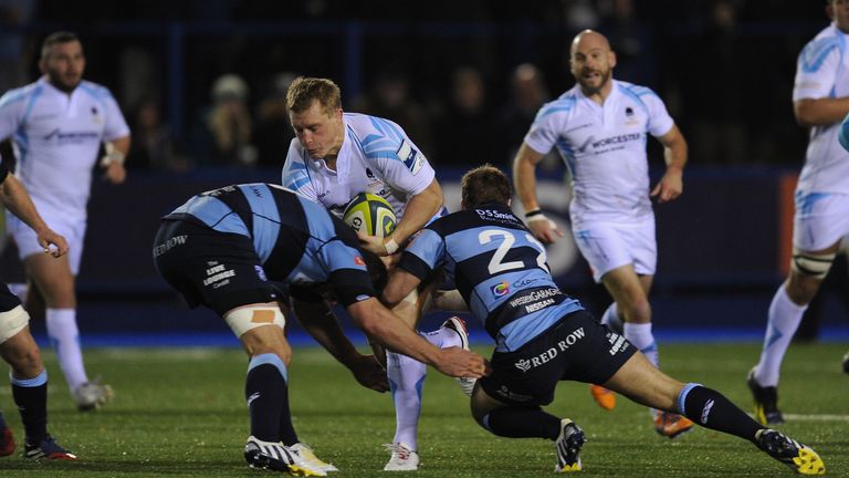 Worcester player Jake Abbott runs into the Blues defence