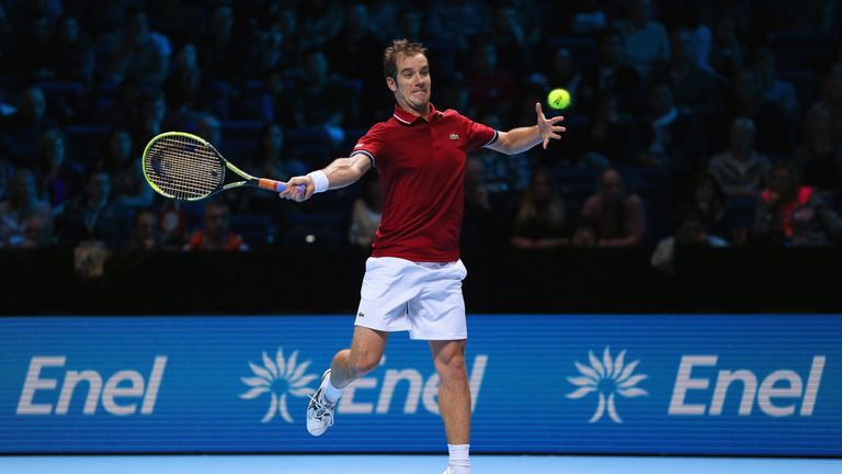 Richard Gasquet hits a forehand in his men's singles match against Novak Djokovic during day six of the Barclays ATP World Tour Finals