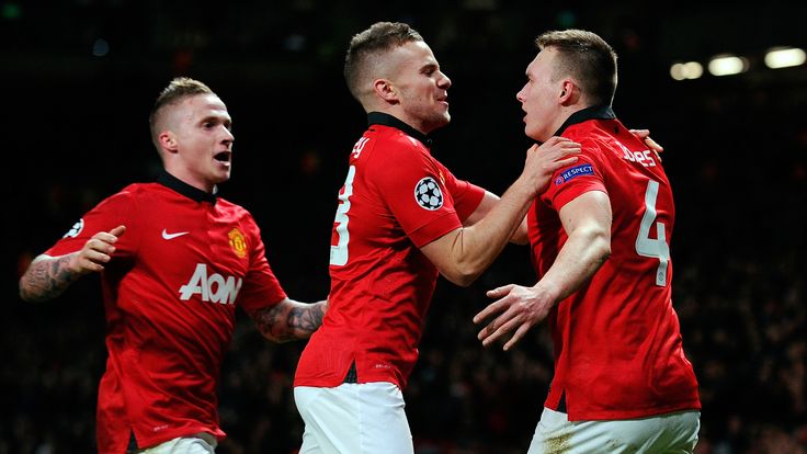 Manchester United's English defender Phil Jones (R) celebrates scoring a goal with team-mate tom cleverley