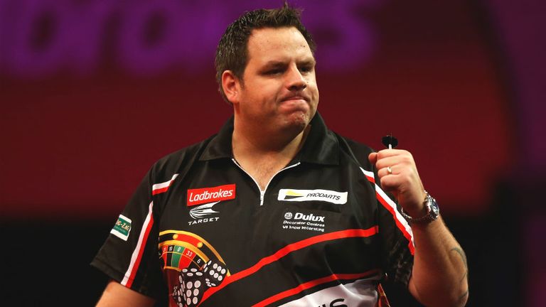 - Adrian Lewis of England celebrates winning a set during his third round match against Mervyn King